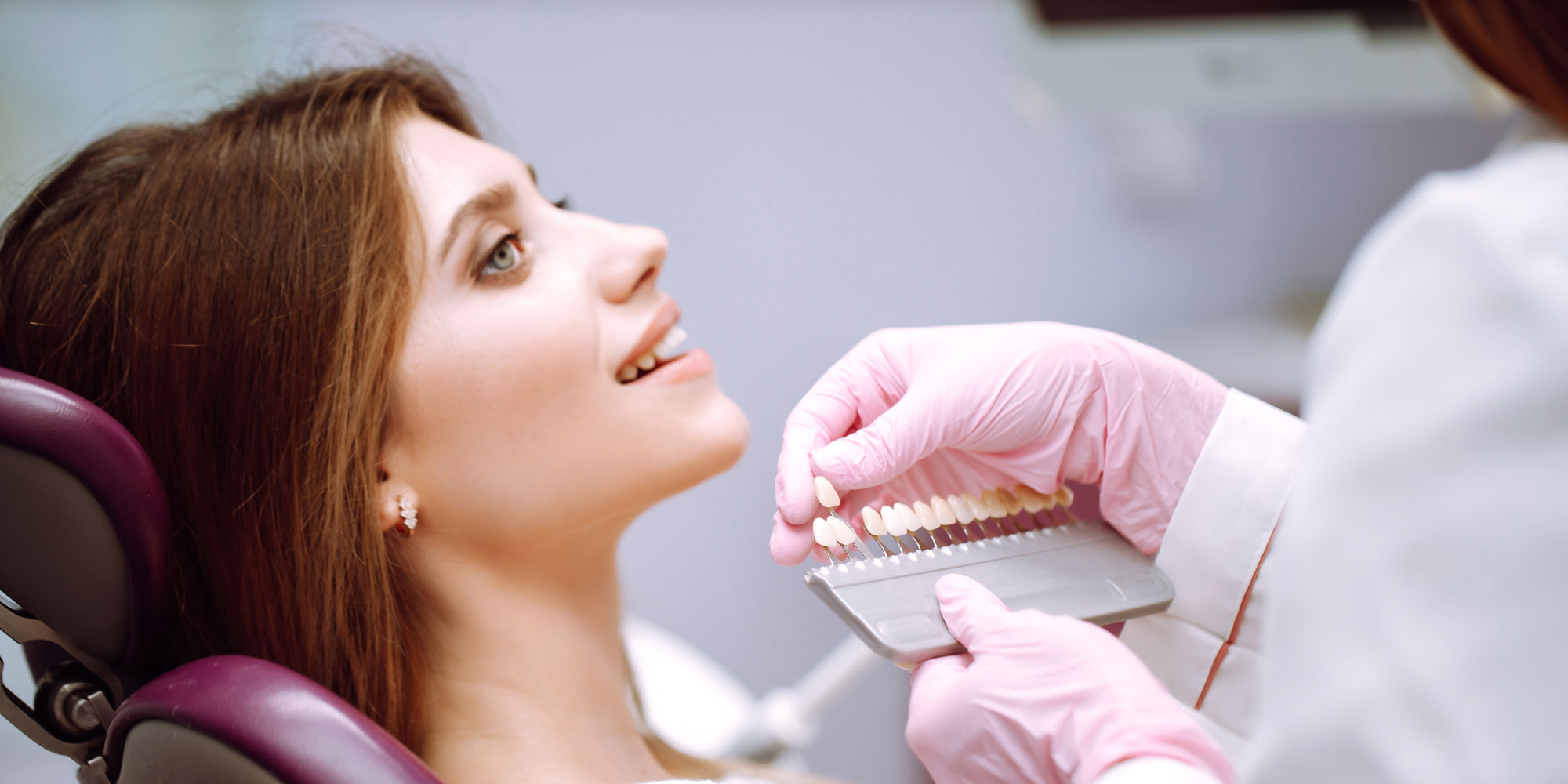 dentist showing veneer options
