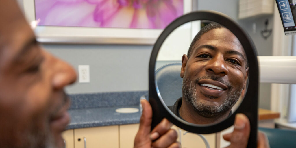 jerrett with mirror seeing new smile