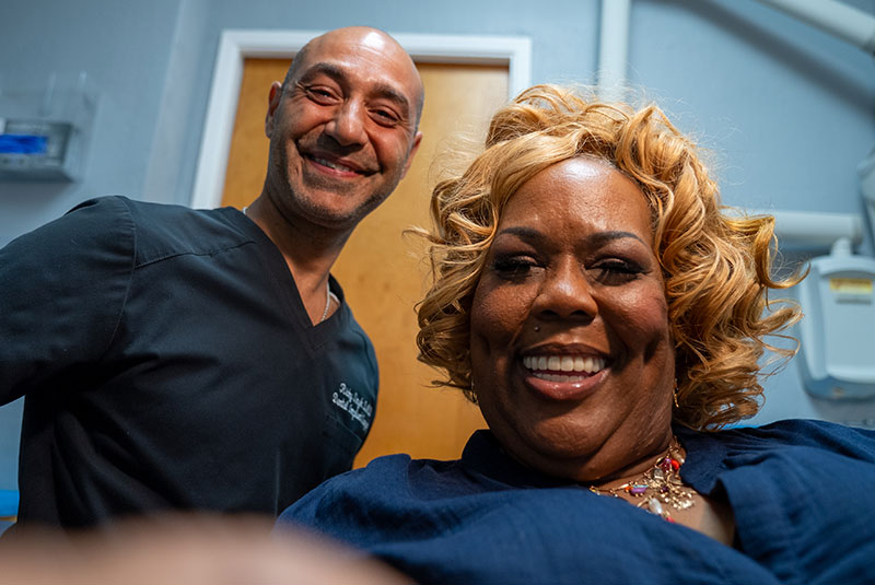 Patient and doctor smiling