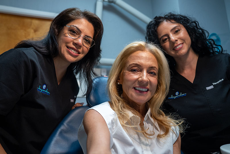 Doctors and Paitent smiling into mirror