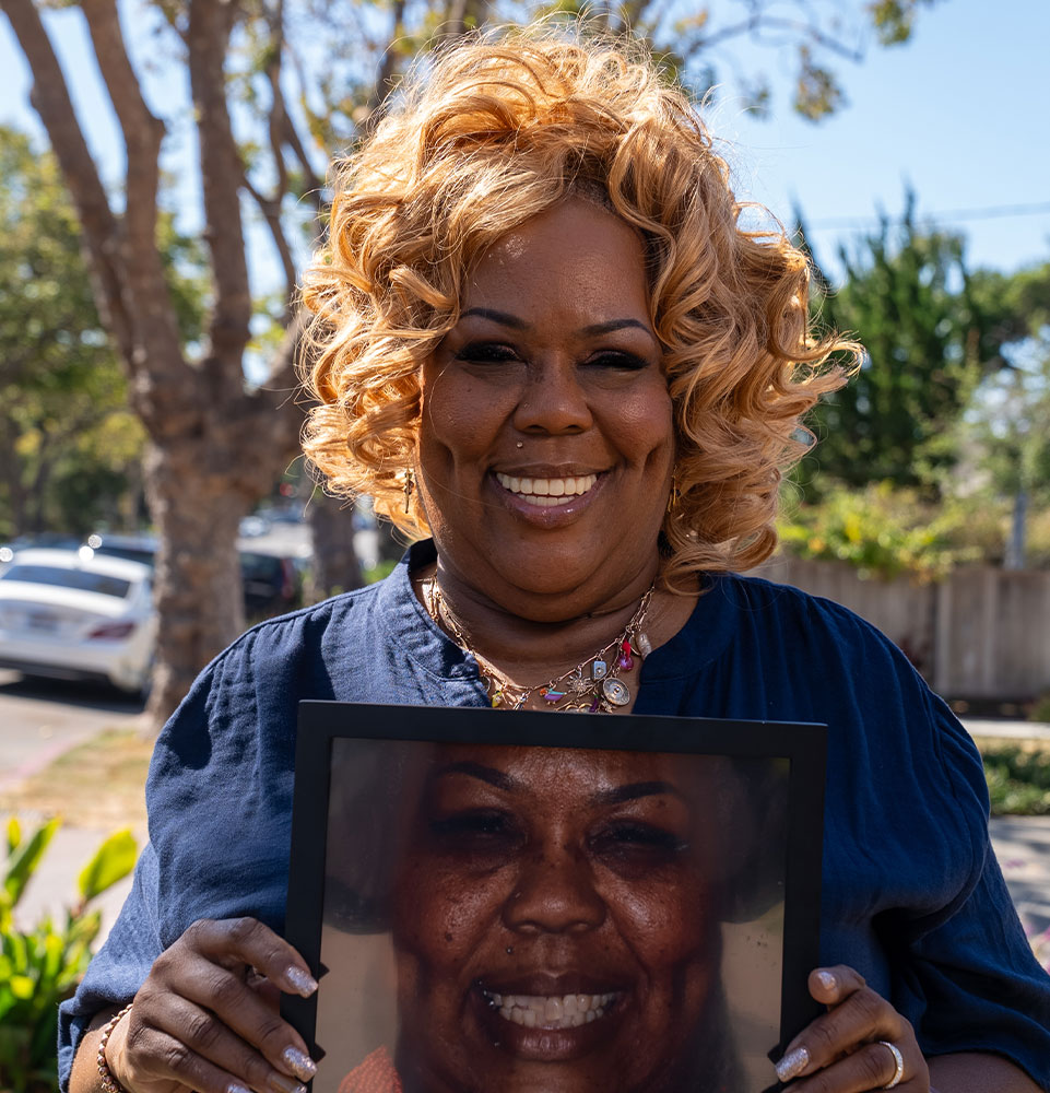 Patient Holding up before and after photo of their teeth